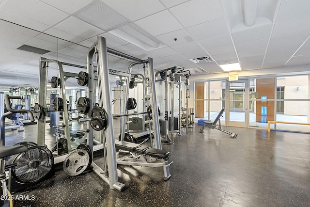 gym featuring a drop ceiling