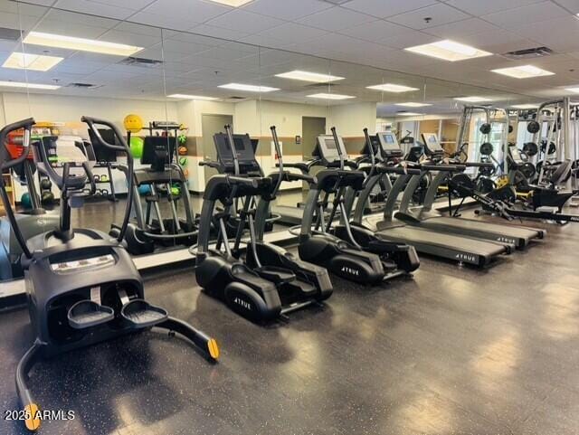 gym featuring a paneled ceiling