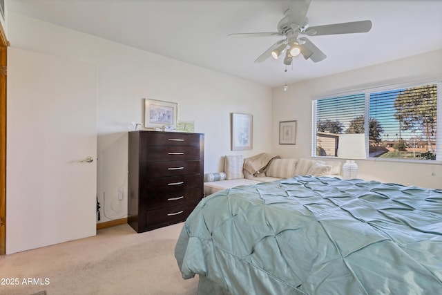 bedroom with ceiling fan and light colored carpet