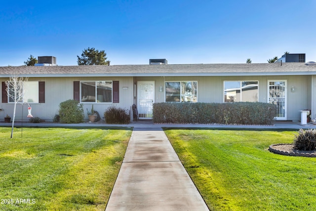 ranch-style home featuring a front yard