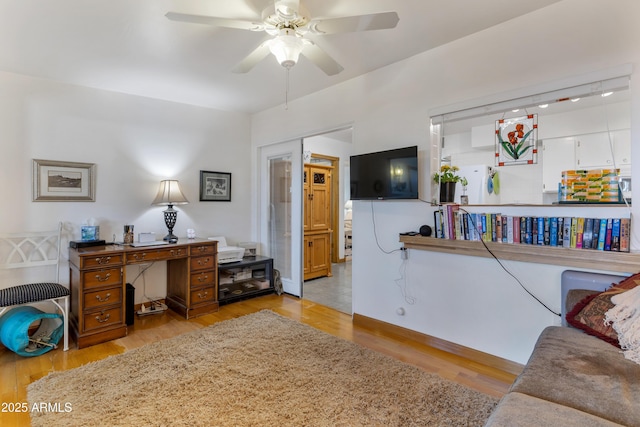 interior space featuring ceiling fan and light hardwood / wood-style flooring