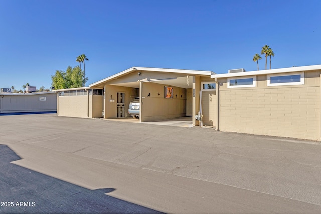 view of front of house with a carport