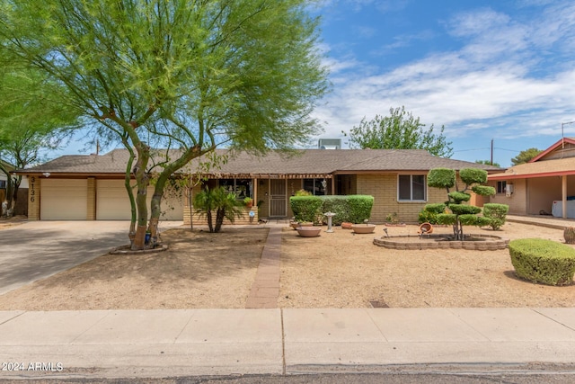 ranch-style home with a garage