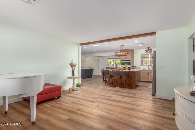 3136 W Sunnyside Ave, Phoenix, AZ 85029 - interior space with beam ceiling and light hardwood / wood-style flooring
