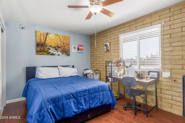 3136 W Sunnyside Ave, Phoenix, AZ 85029 - bedroom featuring dark hardwood / wood-style floors, ceiling fan, and brick wall