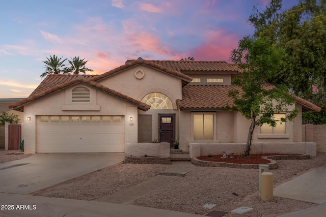 845 N Oak Ct, Chandler, AZ 85226 - mediterranean / spanish-style house featuring driveway, an attached garage, a tile roof, and stucco siding