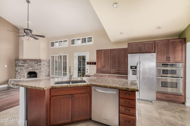 845 N Oak Ct, Chandler, AZ 85226 - kitchen featuring stainless steel appliances, a sink, high vaulted ceiling, ceiling fan, and a kitchen island with sink