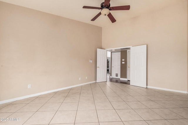 845 N Oak Ct, Chandler, AZ 85226 - spare room with high vaulted ceiling, ceiling fan, light tile patterned floors, and baseboards