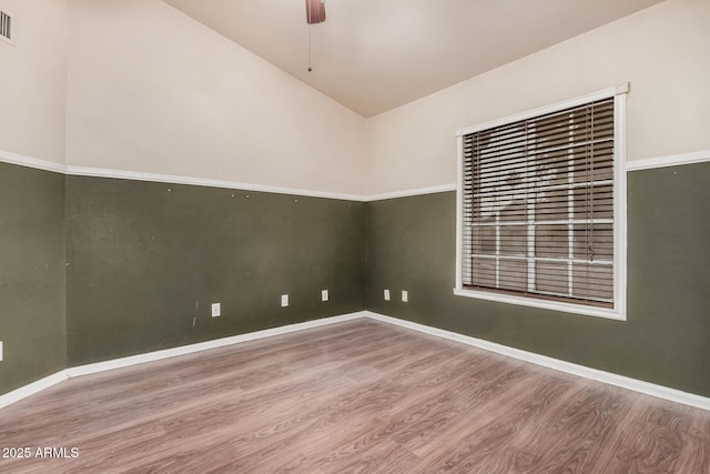 845 N Oak Ct, Chandler, AZ 85226 - unfurnished room with wood finished floors, lofted ceiling, ceiling fan, and baseboards