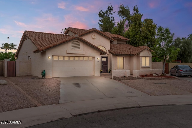845 N Oak Ct, Chandler, AZ 85226 - mediterranean / spanish house featuring a garage, stucco siding, driveway, and a tiled roof