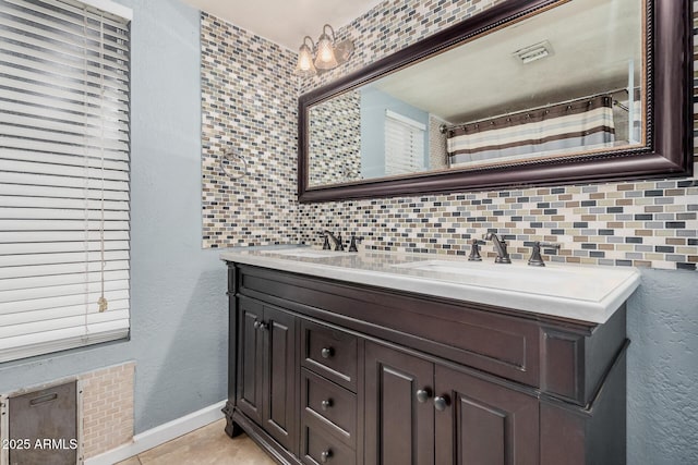 845 N Oak Ct, Chandler, AZ 85226 - bathroom featuring double vanity, baseboards, a textured wall, and tile patterned floors