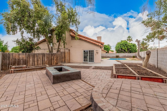 845 N Oak Ct, Chandler, AZ 85226 - fenced backyard with a patio and an outdoor fire pit