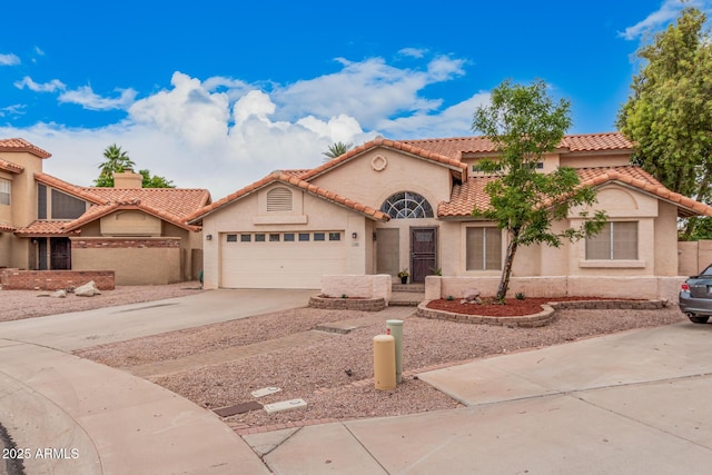 845 N Oak Ct, Chandler, AZ 85226 - mediterranean / spanish-style home with driveway, an attached garage, stucco siding, and a tiled roof