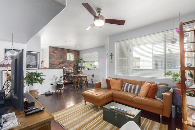 living room featuring ceiling fan and wood-type flooring