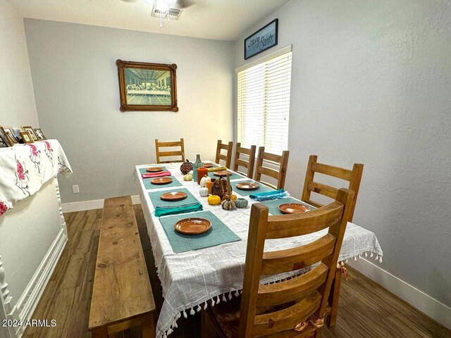 dining space featuring dark hardwood / wood-style flooring