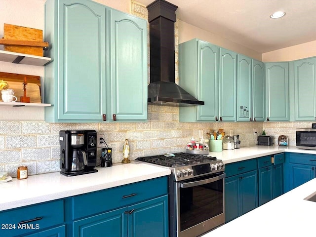 kitchen featuring tasteful backsplash, appliances with stainless steel finishes, and wall chimney exhaust hood