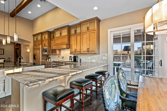 kitchen featuring decorative backsplash, dark hardwood / wood-style floors, beamed ceiling, hanging light fixtures, and sink