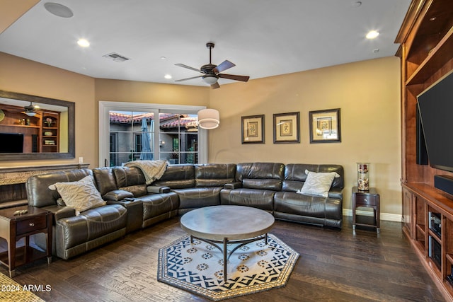 living room with dark hardwood / wood-style floors and ceiling fan