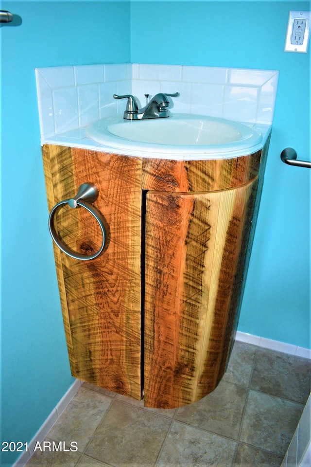 bathroom featuring tile patterned floors and sink