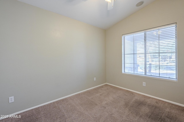 empty room with carpet flooring, ceiling fan, and lofted ceiling