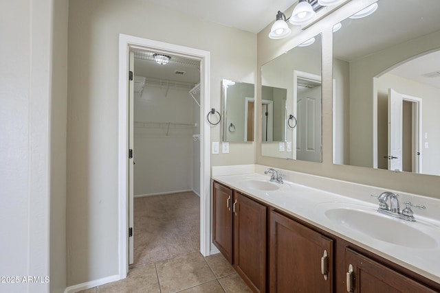 bathroom with tile patterned flooring and vanity