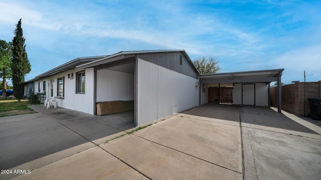 view of property exterior with a carport