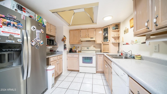 kitchen with light brown cabinetry, light tile patterned floors, stainless steel appliances, and sink