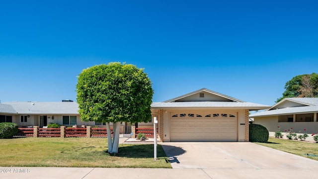 single story home with a garage and a front yard