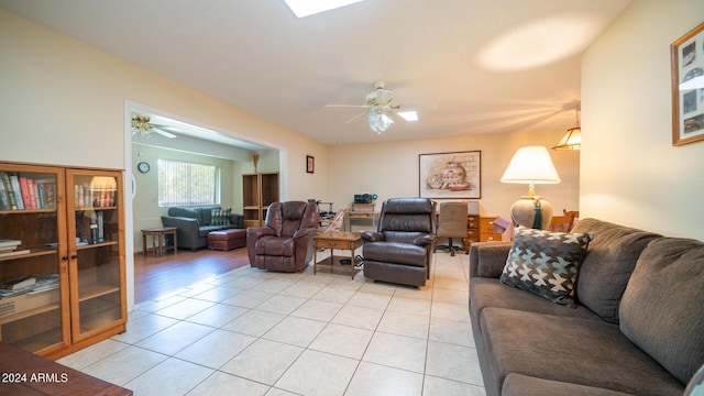 living room with light tile patterned floors and ceiling fan