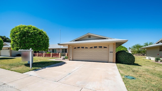 single story home with a garage and a front yard