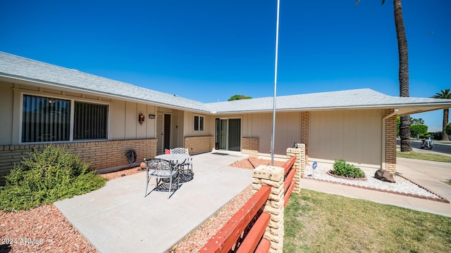 rear view of house with a patio