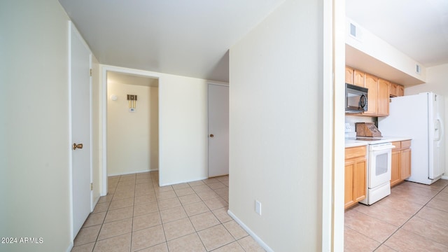 hallway with light tile patterned flooring