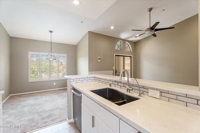 9600 N 96th St Unit 263, Scottsdale, AZ 85258 - kitchen with a sink, light colored carpet, stainless steel dishwasher, baseboards, and pendant lighting