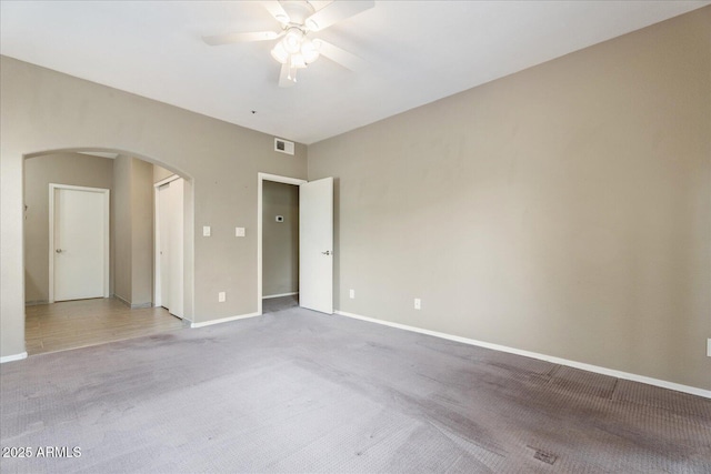 9600 N 96th St Unit 263, Scottsdale, AZ 85258 - carpeted spare room featuring arched walkways, ceiling fan, and baseboards