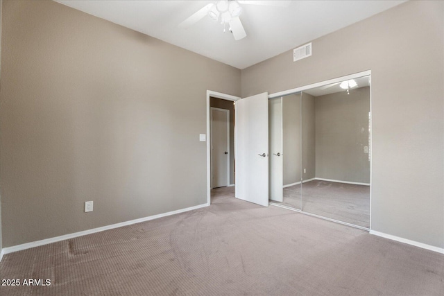 9600 N 96th St Unit 263, Scottsdale, AZ 85258 - unfurnished bedroom with carpet flooring, a closet, baseboards, and a ceiling fan