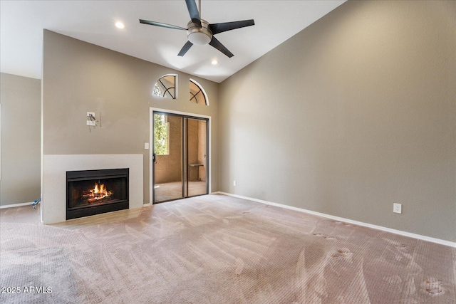 9600 N 96th St Unit 263, Scottsdale, AZ 85258 - unfurnished living room featuring carpet flooring, a ceiling fan, a fireplace with flush hearth, baseboards, and recessed lighting