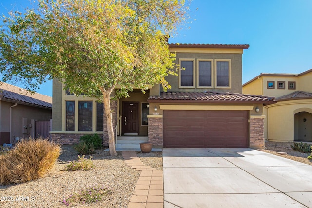 view of front of home with a garage, stone siding, driveway, and stucco siding