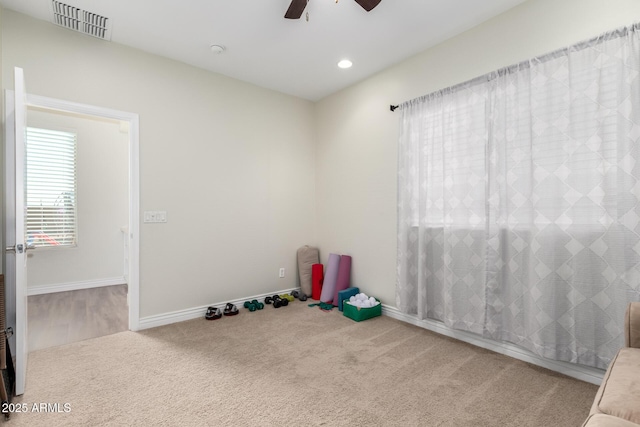 interior space featuring recessed lighting, visible vents, carpet flooring, ceiling fan, and baseboards