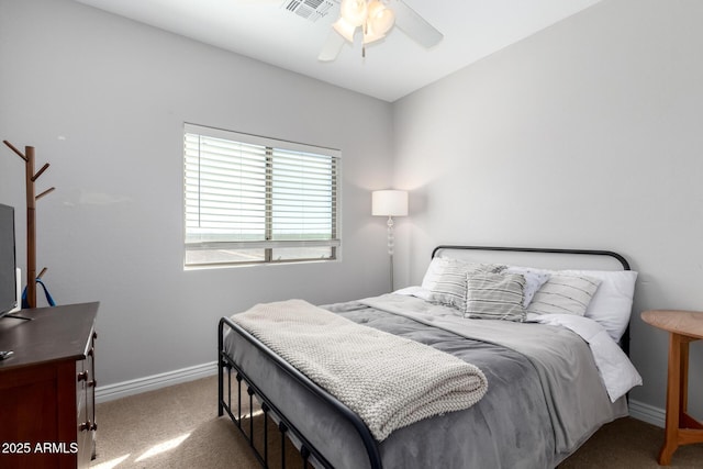 bedroom with dark colored carpet, a ceiling fan, visible vents, and baseboards