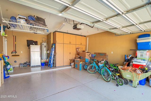 garage with water heater, a garage door opener, and freestanding refrigerator