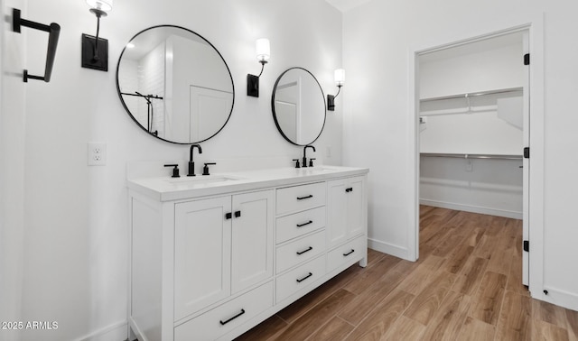 bathroom featuring vanity and hardwood / wood-style floors