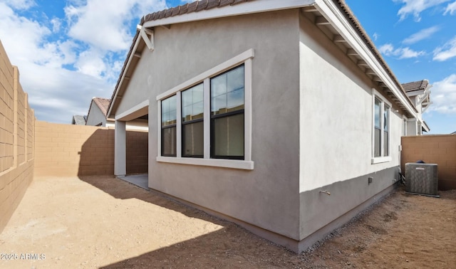 view of home's exterior featuring central air condition unit