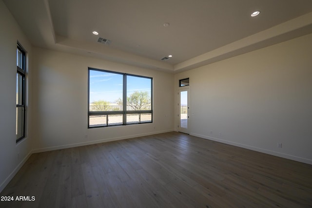 13272 E Ln Junta Rd, Scottsdale, AZ 85255 - spare room featuring a raised ceiling, wood-type flooring, baseboards, and recessed lighting