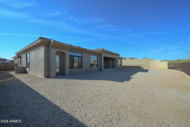 13272 E Ln Junta Rd, Scottsdale, AZ 85255 - back of property featuring a fenced backyard, stucco siding, and a tile roof