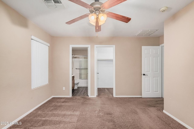 3719 W Carson Rd, Phoenix, AZ 85041 - unfurnished bedroom featuring carpet floors, ensuite bathroom, and a ceiling fan