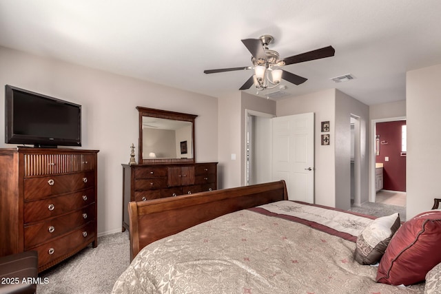 carpeted bedroom featuring connected bathroom and ceiling fan