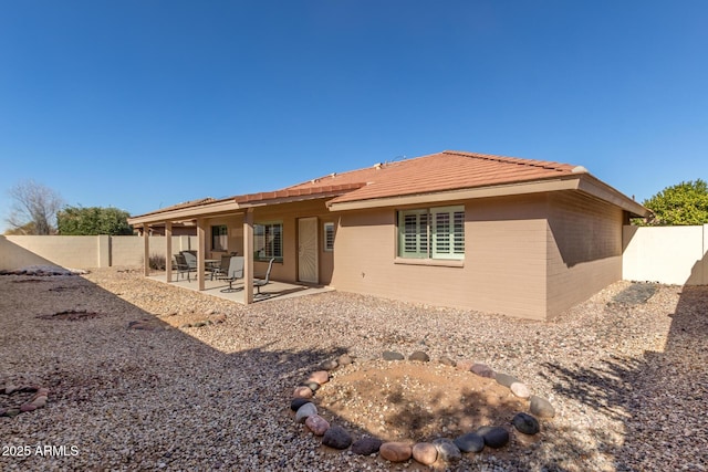 rear view of house with a patio