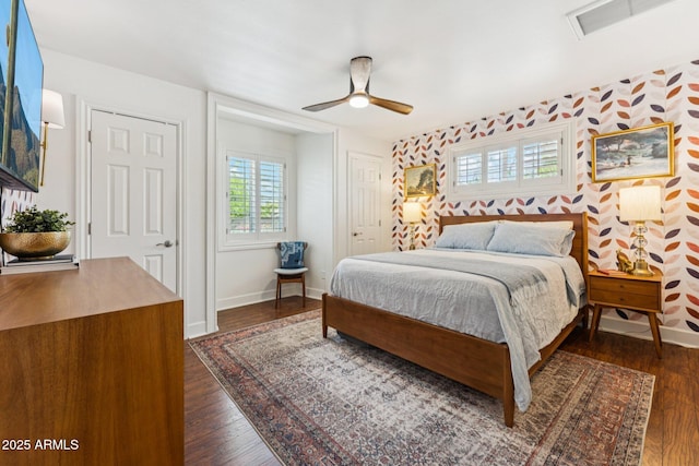 3201 E Colter St, Phoenix, AZ 85018 - bedroom with dark wood-style flooring, a ceiling fan, and multiple closets
