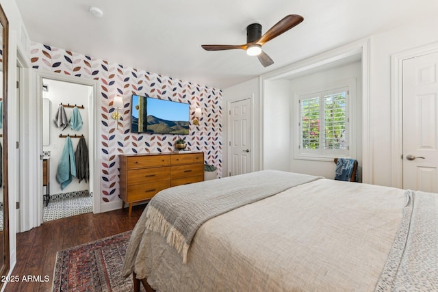 3201 E Colter St, Phoenix, AZ 85018 - bedroom featuring dark wood finished floors, wallpapered walls, ensuite bath, a ceiling fan, and an accent wall