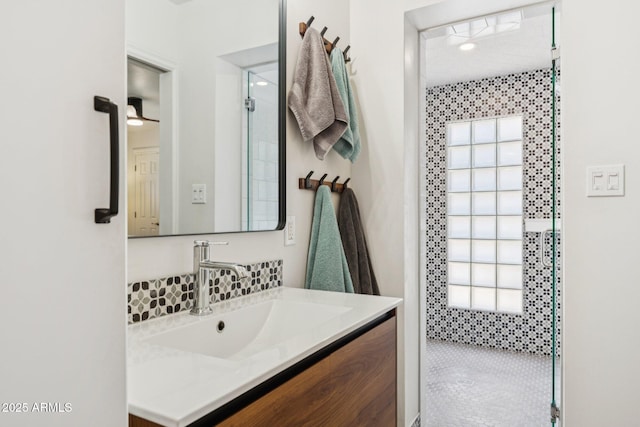 3201 E Colter St, Phoenix, AZ 85018 - bathroom with vanity, a shower, and backsplash
